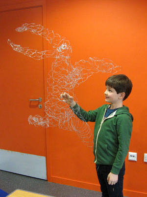 Look at this big funky wire dragon sculpture!
